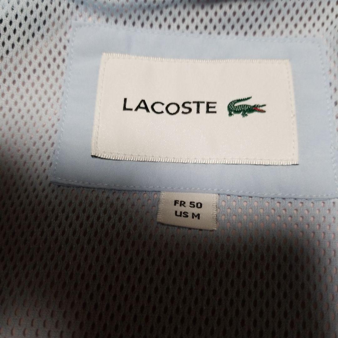 新品未使用。正規LACOSTEスポーツウインドブレーカー「フード付き」