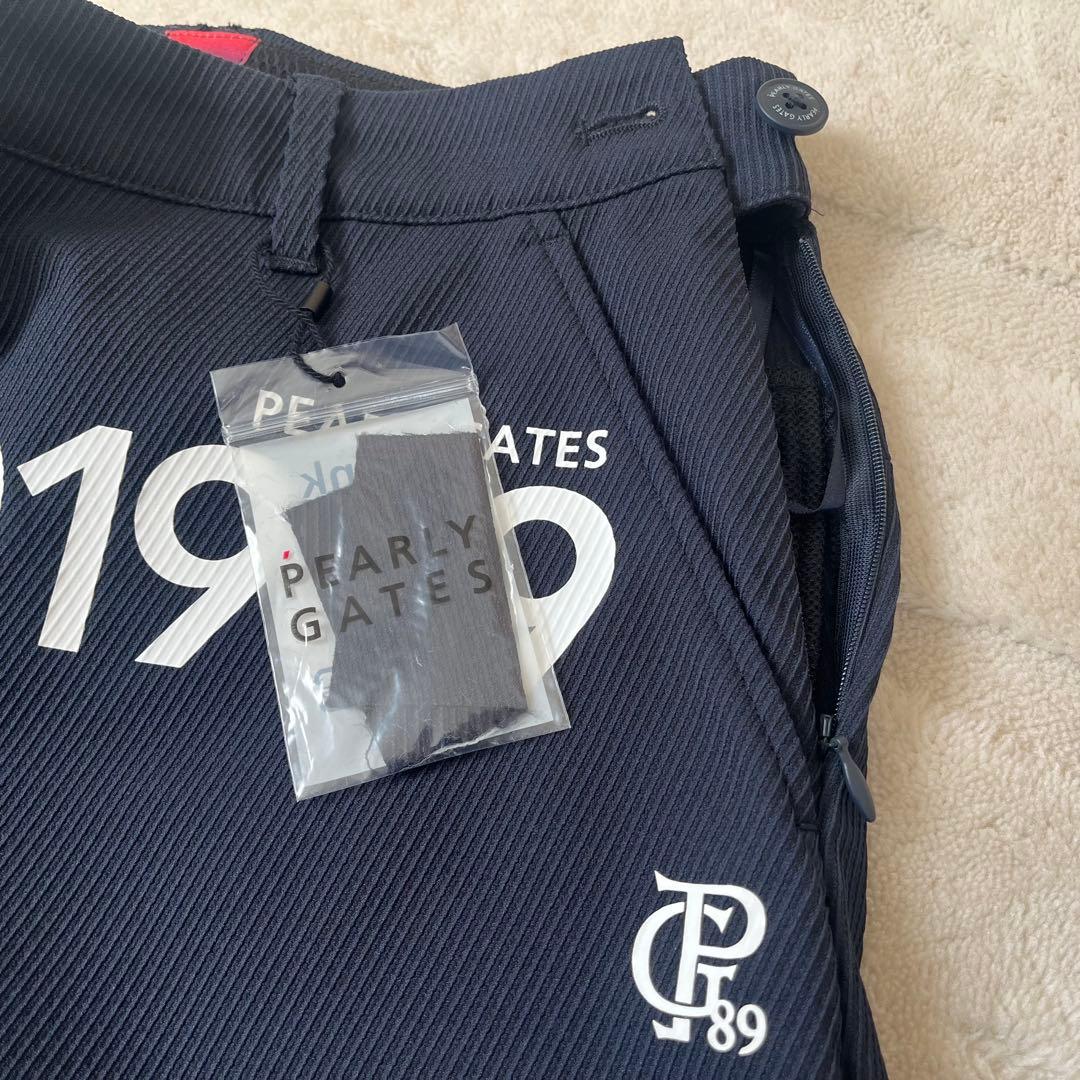 新品★28,600円 パーリーゲイツ 春夏ゴルフスカート 裾プリーツ 濃紺×白０