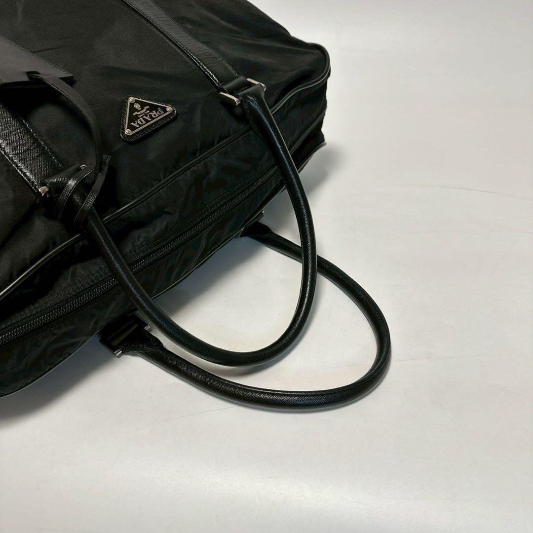 u35【近年モデル】保存袋付　プラダ　サフィアーノ　黒　南京錠　ハンドバッグ.