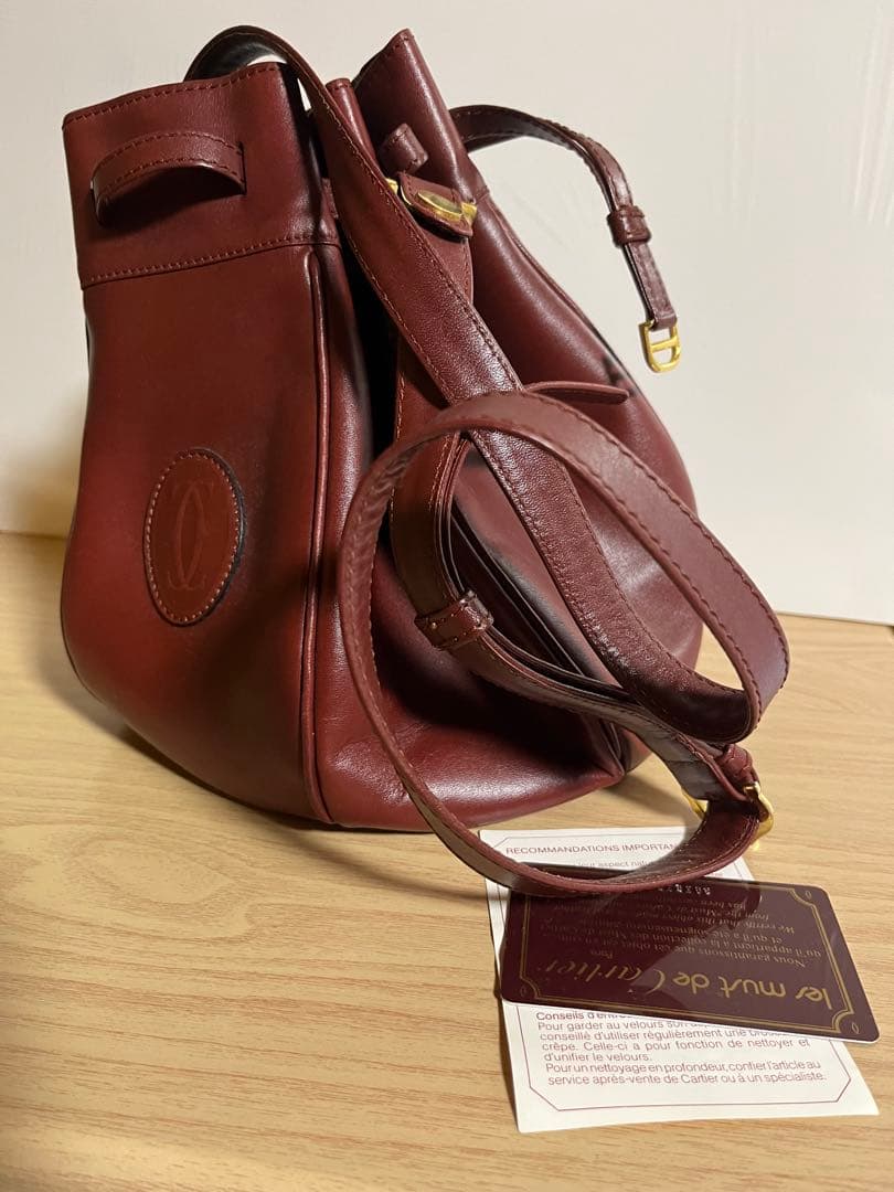 【未使用品 】カルティエ マストライン 巾着ショルダーバッグ レザー ボルドー