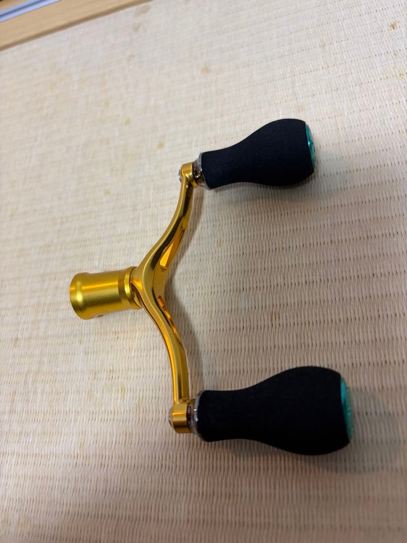 ダイワ純正ダブルハンドル15エメラルダスAIR未使用 カスタムハンドル ゴールド