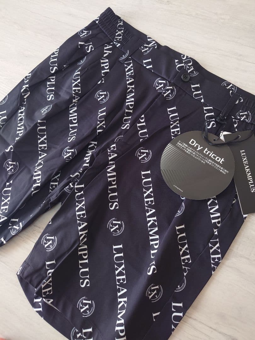 新品XLサイズ セットアップ 総柄ロゴ 上下セット リュクスエイケイエムプラス